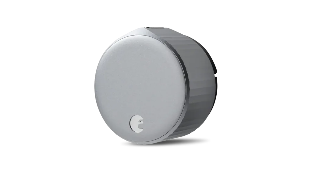Isolated side-view photograph of the round, silver August Wi-Fi Smart Lock.