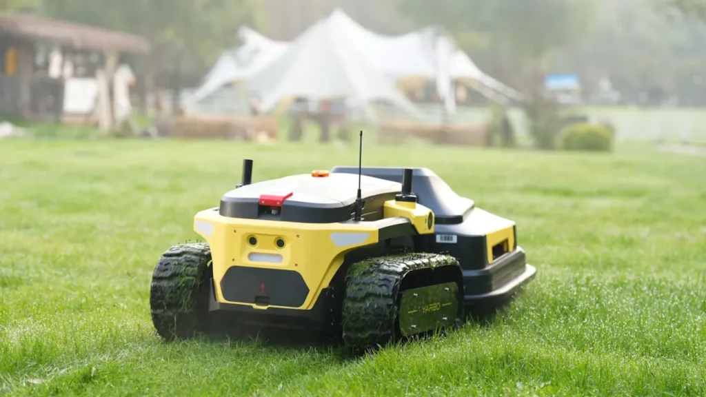 A Yarbo tracked all-terrain robot lawn mower cutting grass, designed for steep hills and complex yards.