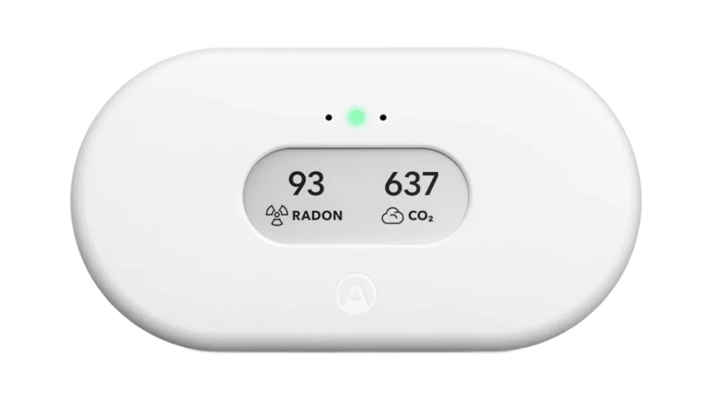Airthings View Plus combo air quality monitor displaying radon and CO2 readings side by side.