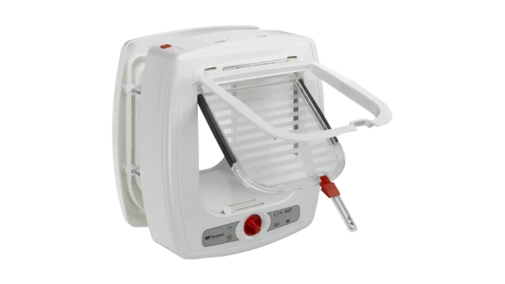 White Ferplast Swing microchip cat flap with an open clear door and a red manual locking dial.