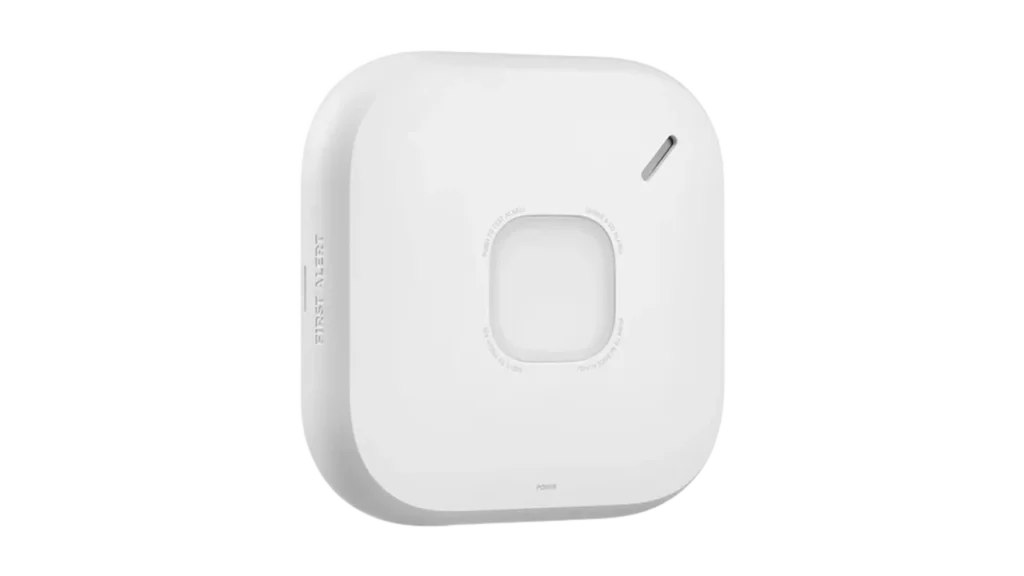 First Alert SC5 smart smoke and carbon monoxide alarm with test button and status light.