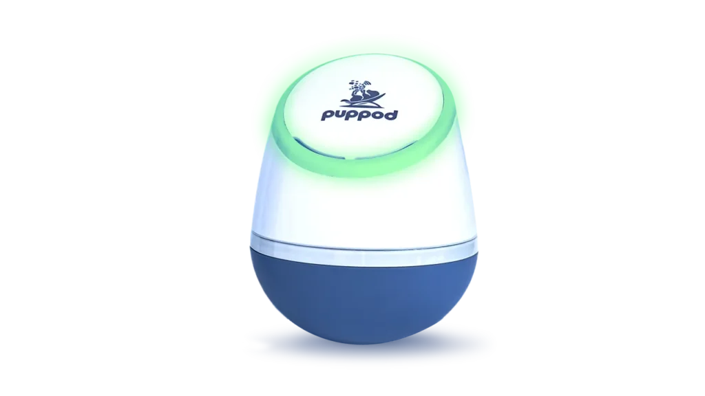 The PupPod interactive rocker toy with a glowing green light ring that prompts the dog to play.