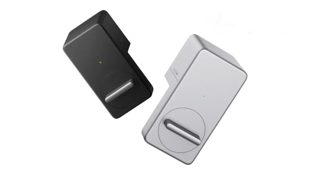 Black and silver SwitchBot smart lock motorized deadbolt turners.