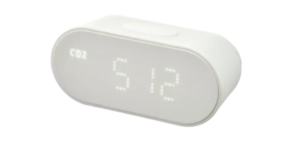 IKEA ALPSTUGA air quality sensor showing a CO2 reading of 512 ppm on its rounded white display.