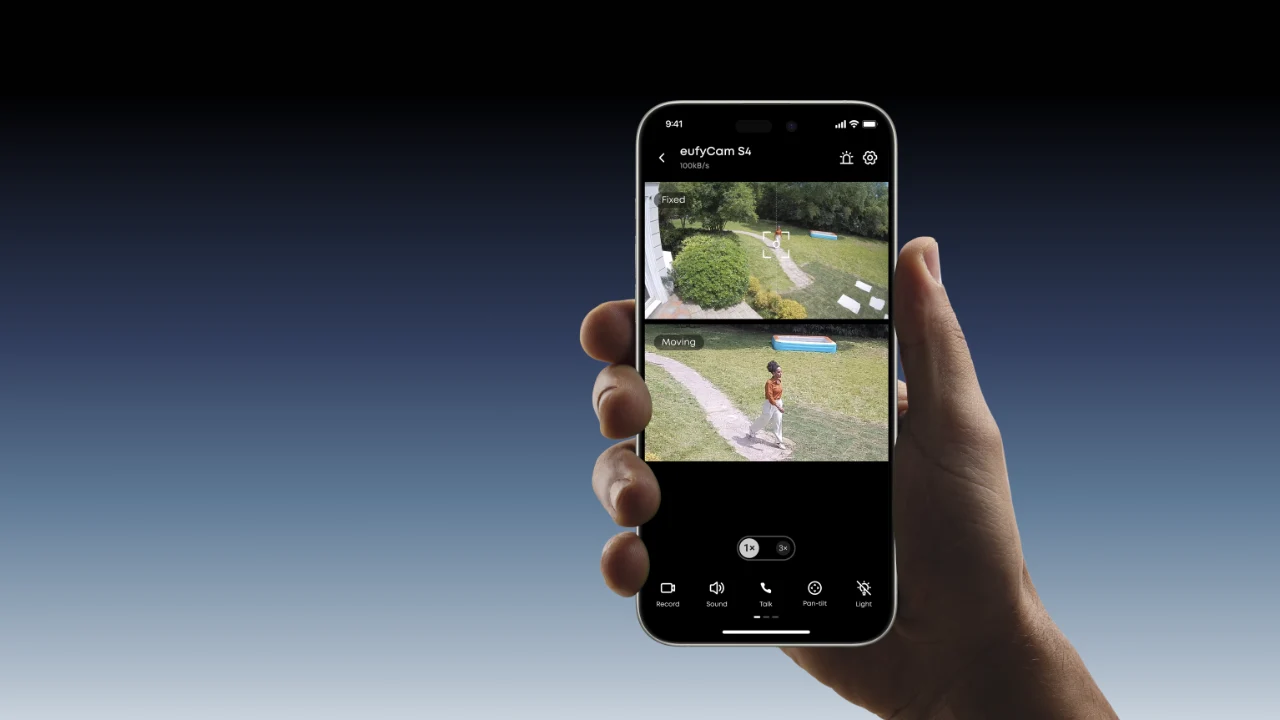 Hand holding a phone showing two stacked live views from a eufyCam S4 in the eufy app
