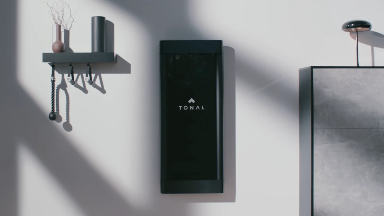 Tonal 2 smart home gym mounted flat on a wall in a modern living space
